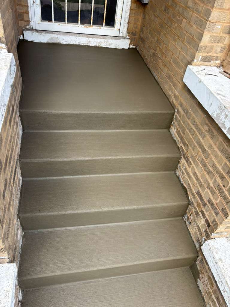 Finished concrete front steps after full rebuild — Chicago, IL