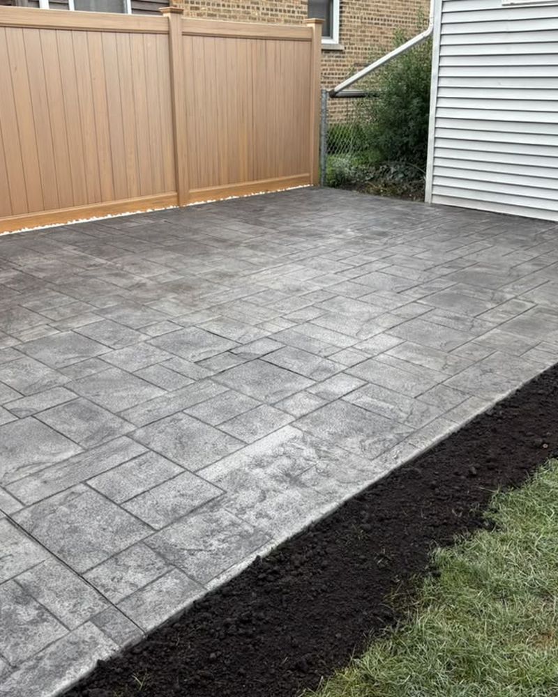 Stamped patio finished with a fresh mulch bed — Chicago, IL