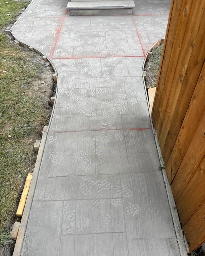 Stamped walkway running along the fence line — Chicago, IL