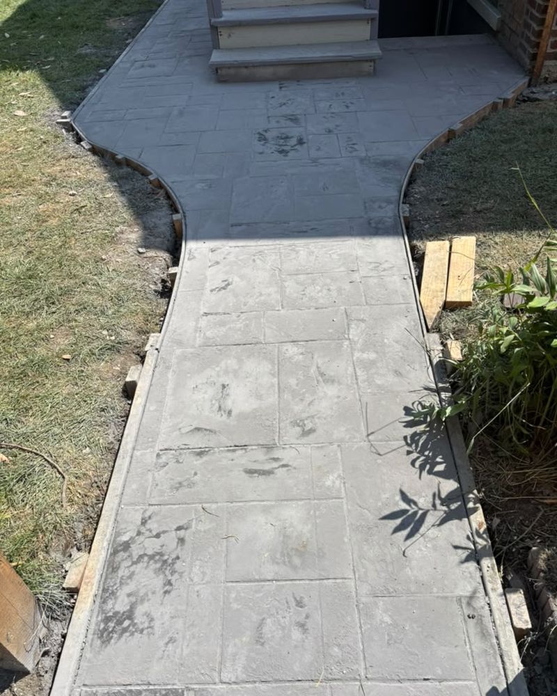 Curved stamped walkway leading to the back stairs — Chicago, IL