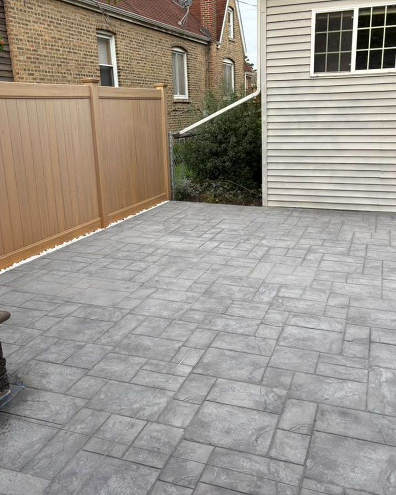Stamped patio with a poured concrete step — Chicago, IL
