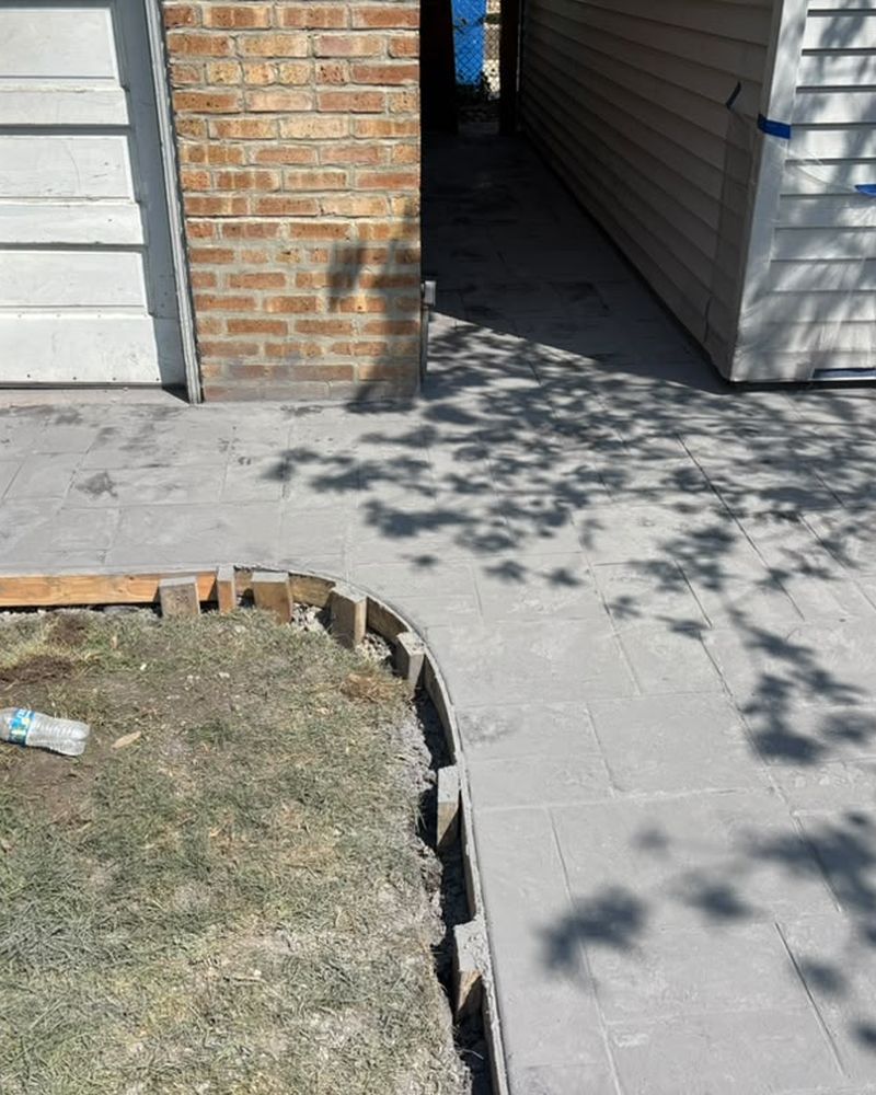 Stamped walkway beside a brick wall — Chicago, IL
