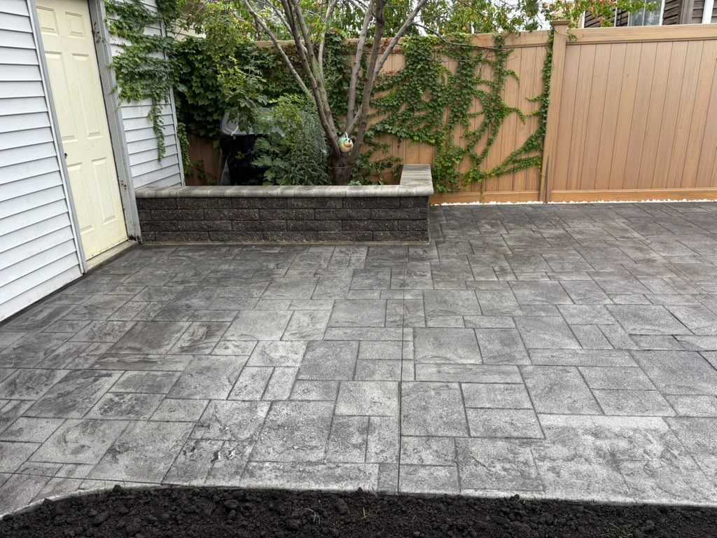 Stamped patio with block wall along the fence line — Chicago, IL