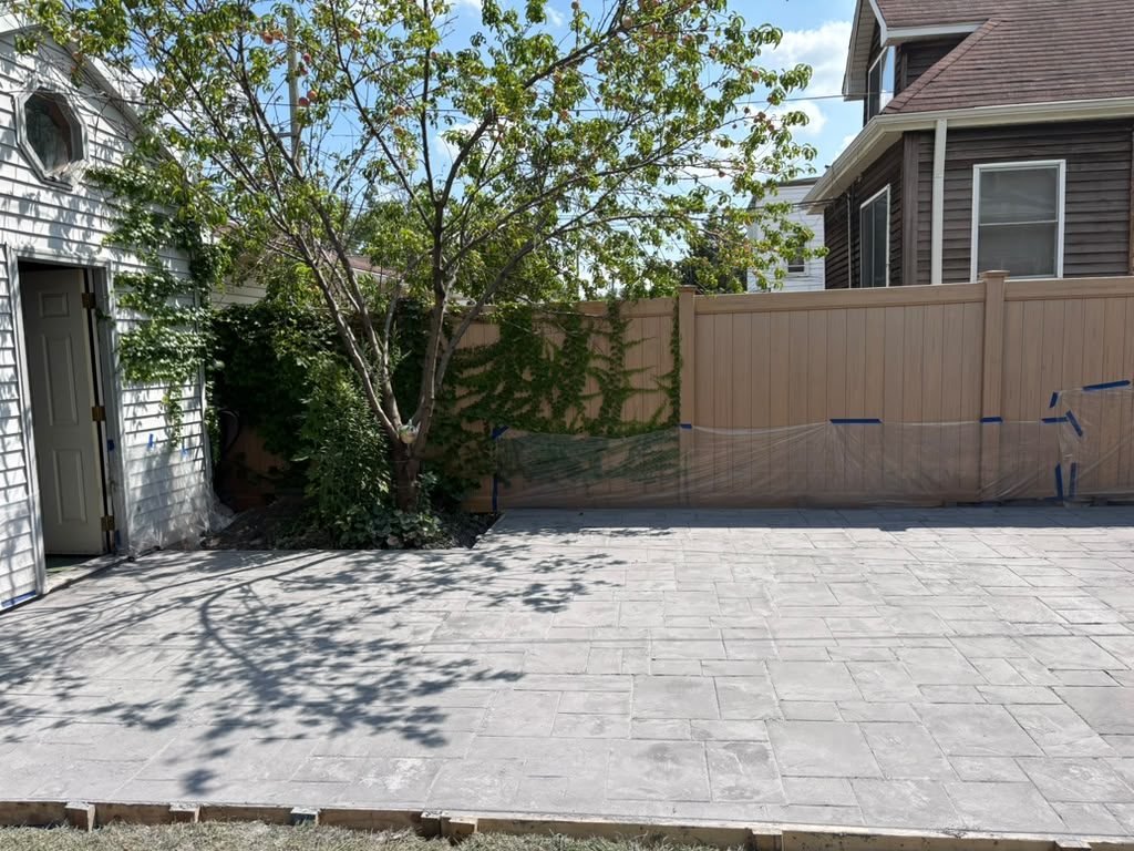 Finished stamped concrete patio in a Chicago backyard