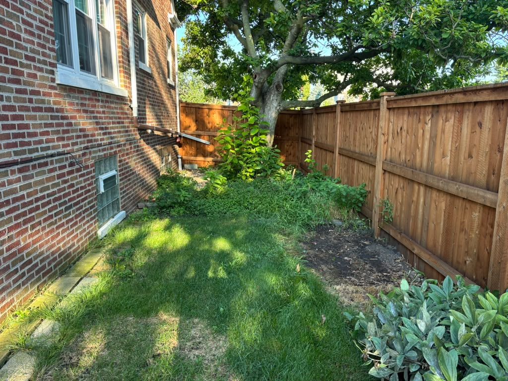 Side yard grass before the concrete patio slab — Chicago, IL