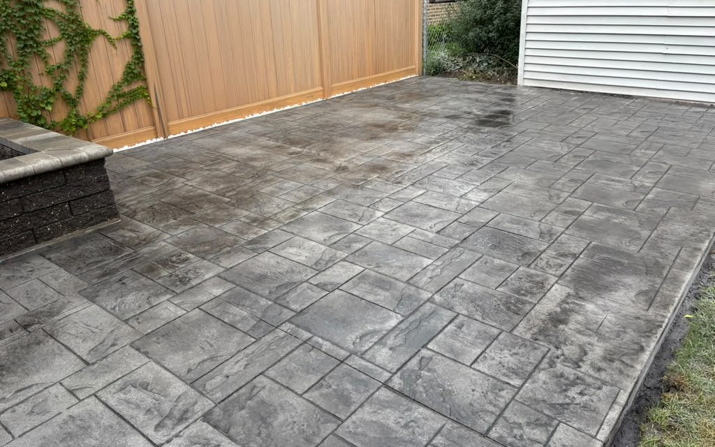 Finished stamped concrete patio in a Chicago backyard