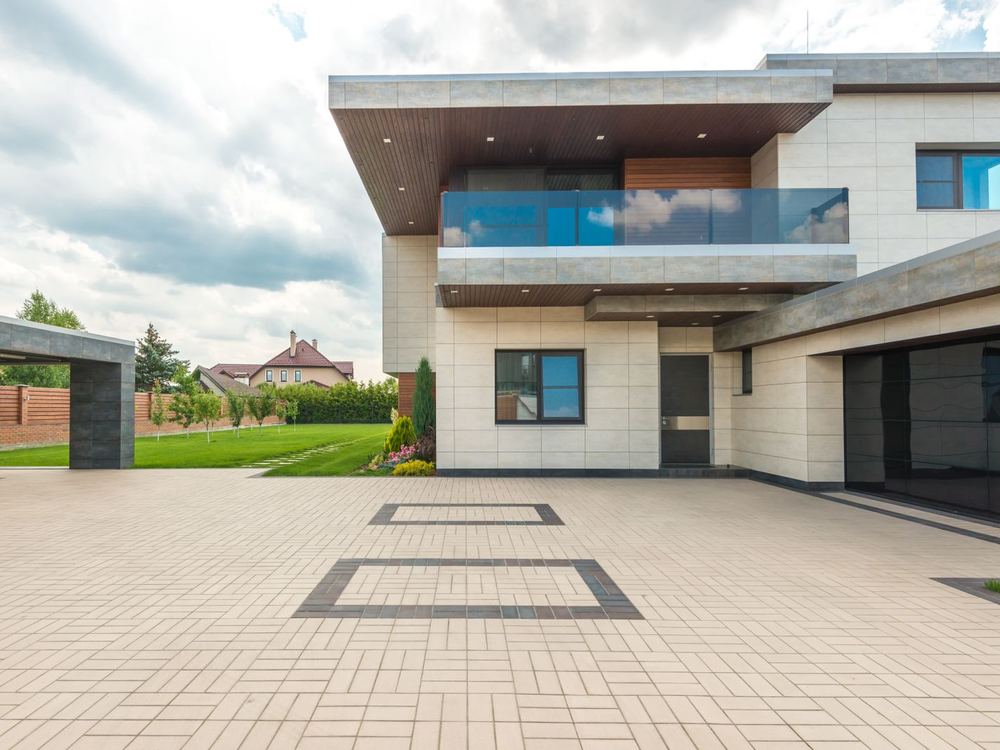 Residential concrete driveway in front of a home